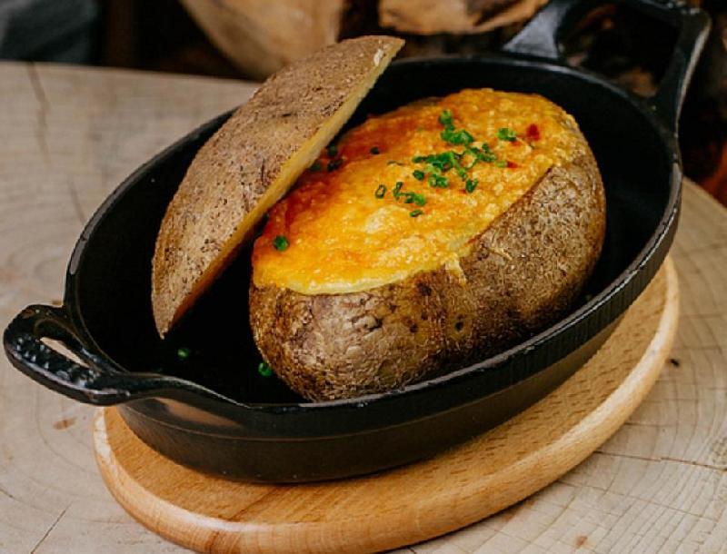 Triple Baked Potato with Cheese, Bacon, Shallots, Chives and Sour Cream