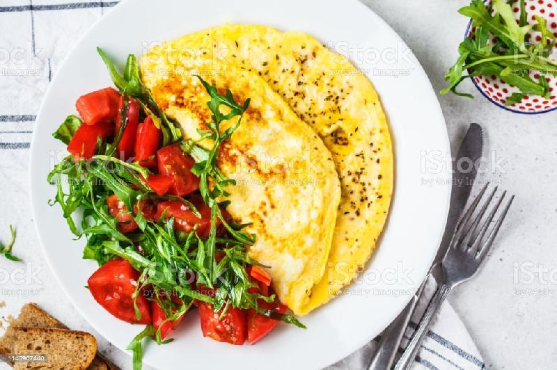 Omelet With Tomatoes And Salad