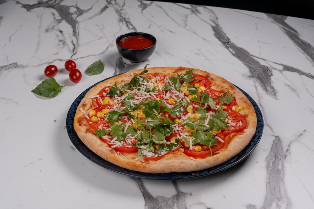 Pizza tomatoes with corn 